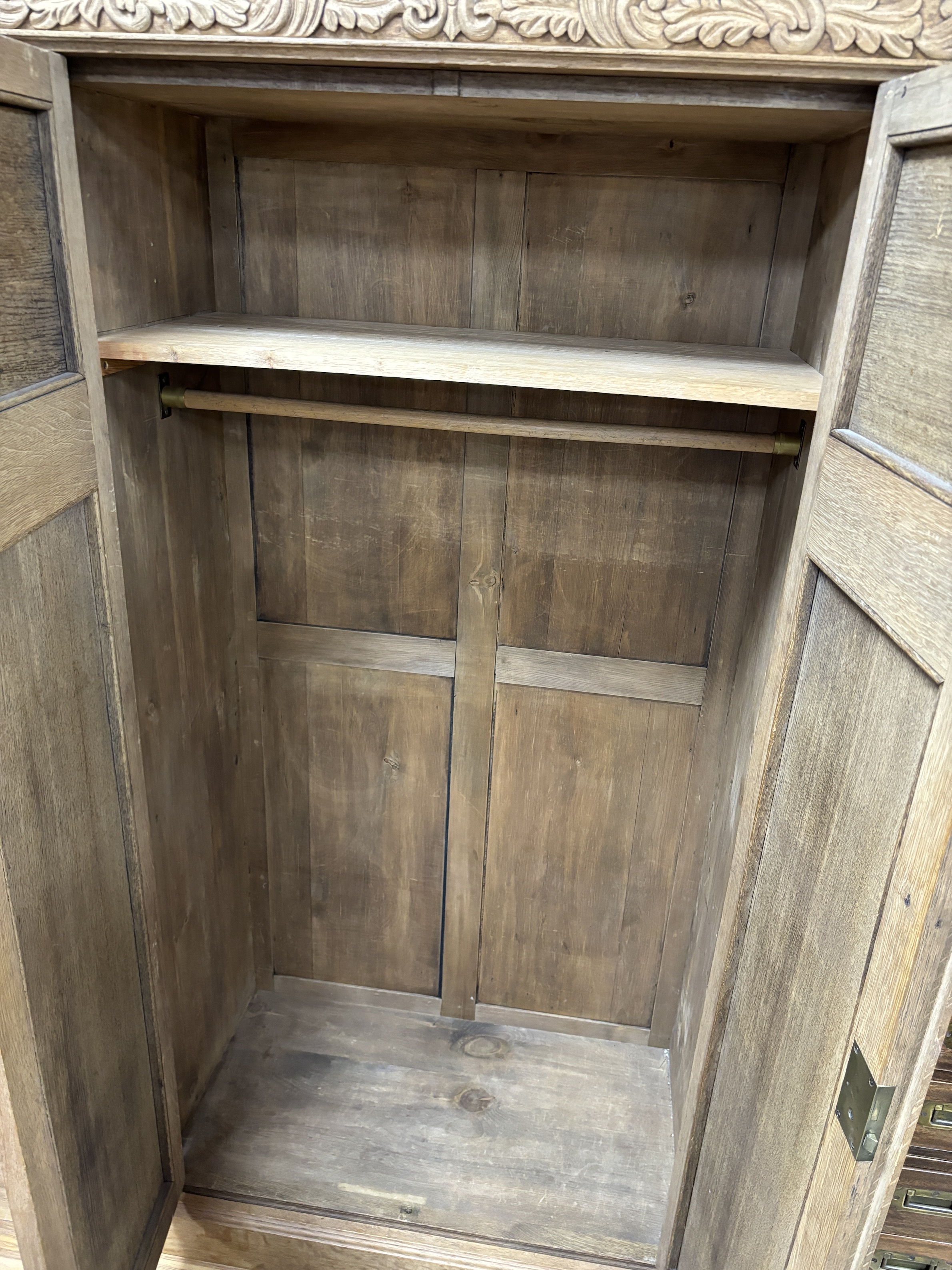 A late Victorian carved bleached oak wardrobe, width 103cm, depth 53cm, height 191cm